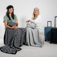 Soft black and white chain link cotton travel blankets with matching eye masks, perfect travel gifts for women.