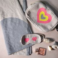 The perfect travel set organiser for women, featuring the Crazy Hearts soft blanket, sleep mask, and compact zip bag.