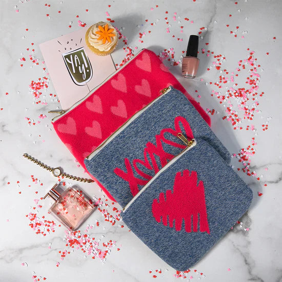 Pink Lemonade Hearts and XOXO makeup pouches with perfume, nail polish, cupcake, and confetti.