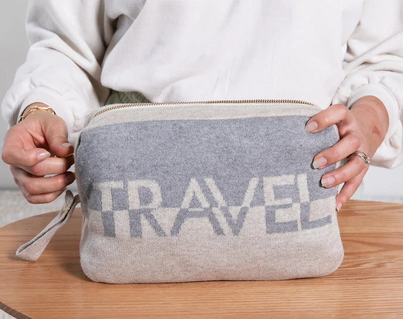 Pink Lemonade Dual Travel Organic Cotton Travel Blanket and Eye Mask Set pouch with woven “Travel” design.
