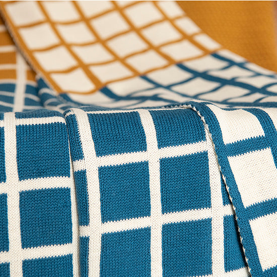 Sveda Reversible Squares Organic Cotton Throw Blanket reversible organic cotton throw blanket with soft structured knit texture