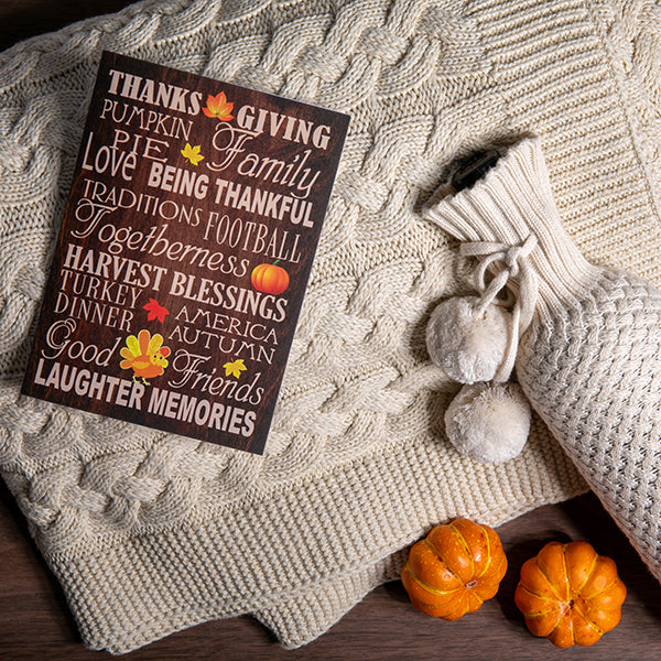 Thanksgiving-themed decorative gifts including a white knitted wing bag and double cable knitted organic cotton throw.